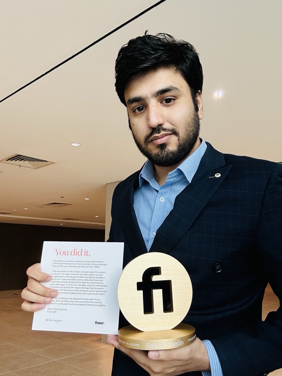 Selfie with the Fiverr Millionaire trophy and CEO letter showing Zain Ul Abedin engraving
