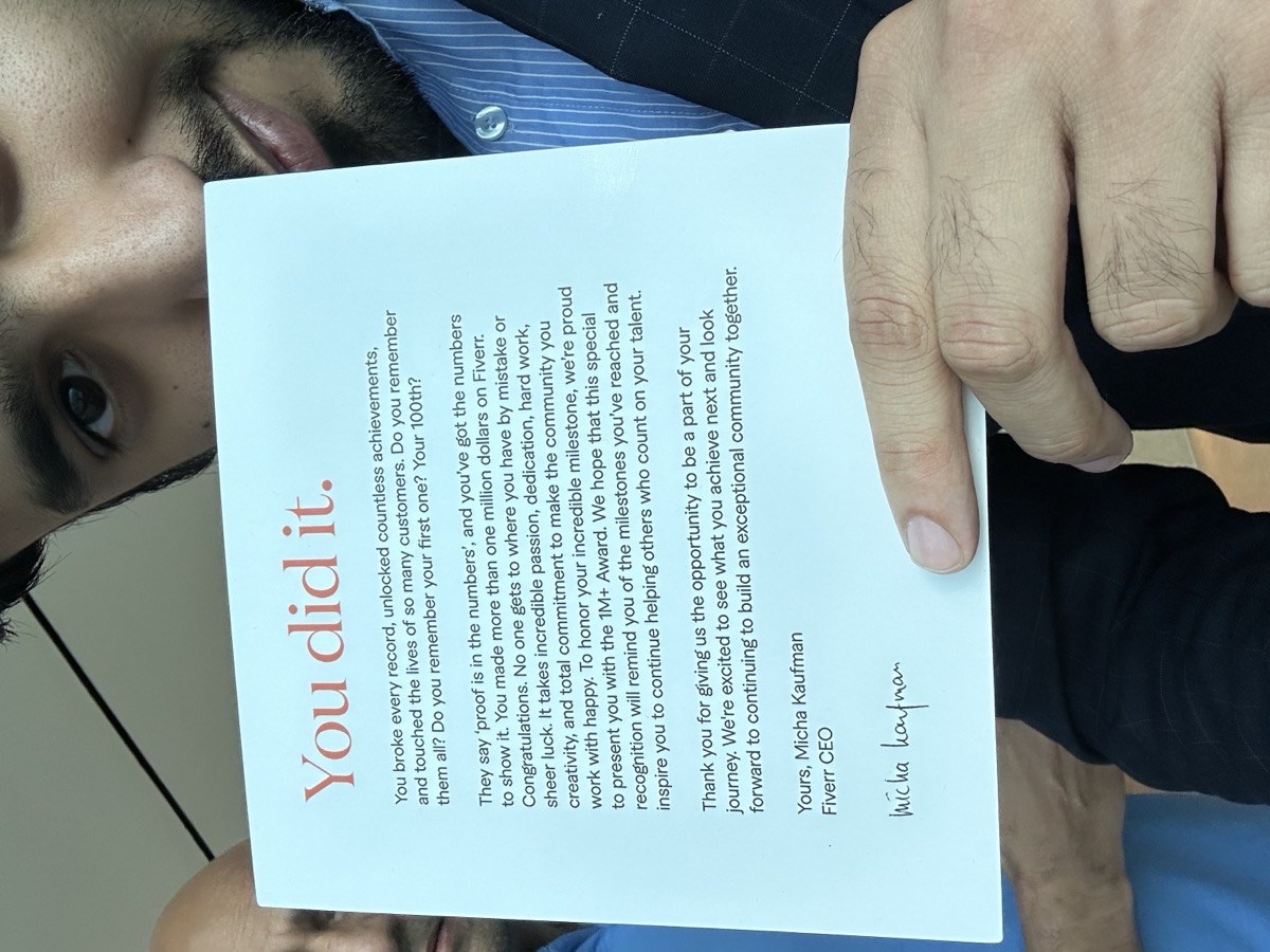 Close-up of the Fiverr CEO letter signed by Micha Kaufman congratulating on $1M milestone