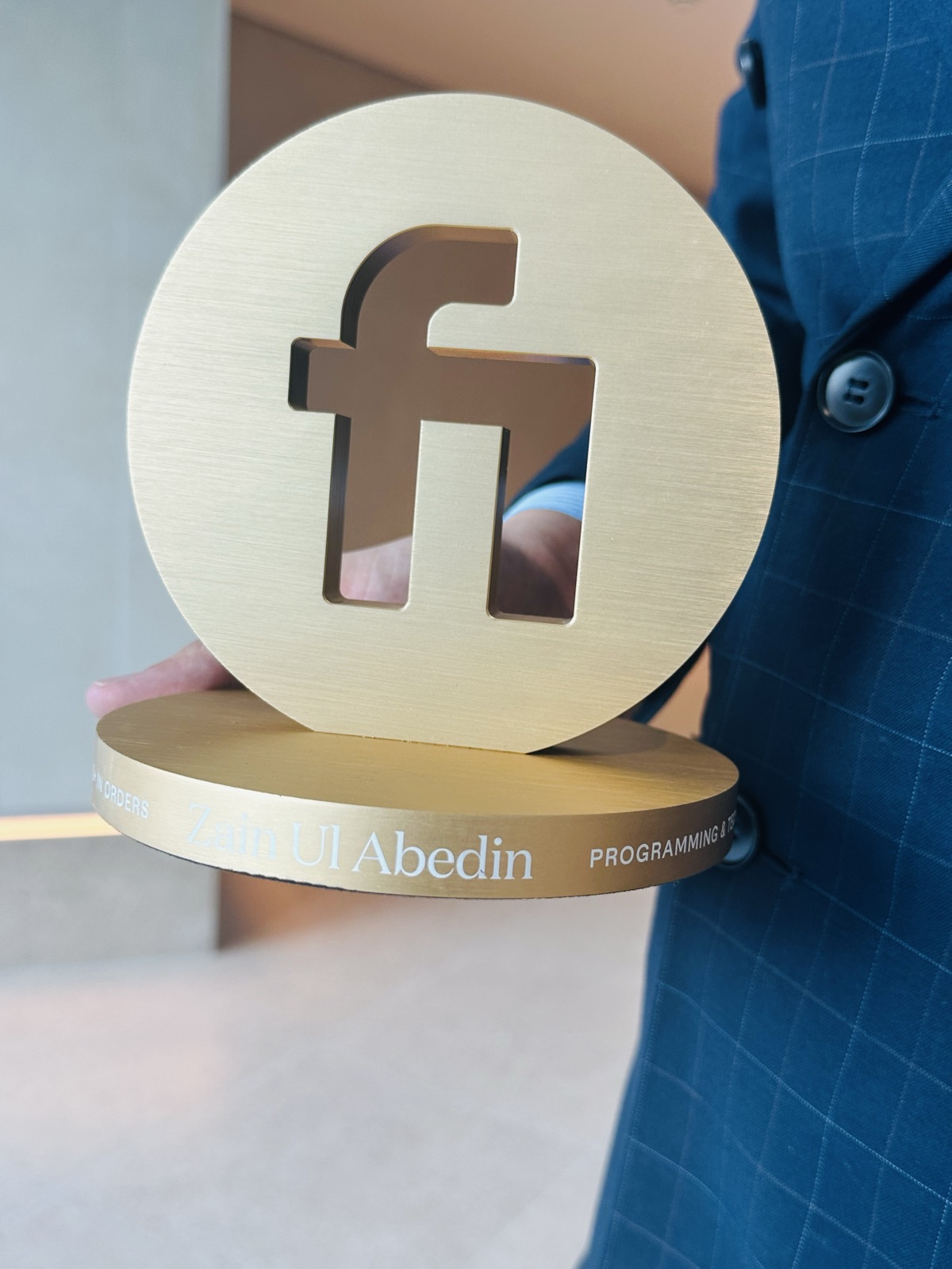Closeup of Fiverr Millionaire trophy engraving showing Zain Ul Abedin and Programming and Tech category